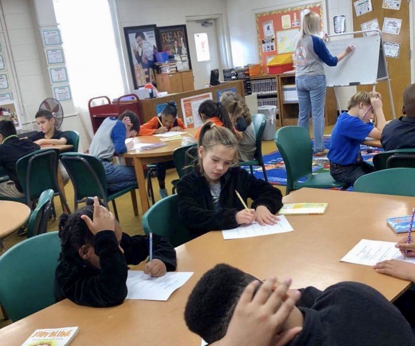 Students quietly read in the library at East Elementary